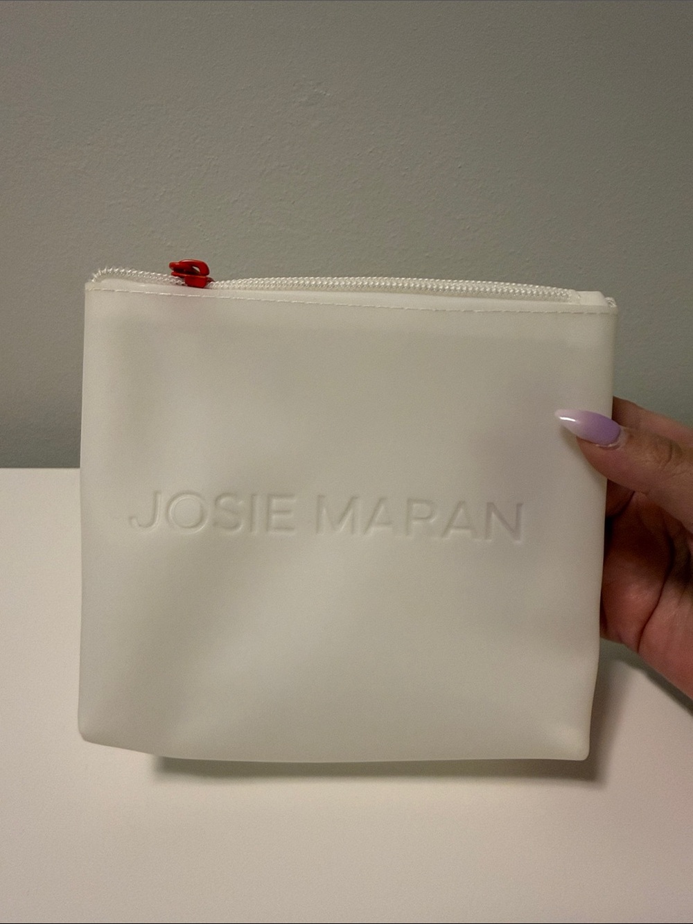 JOSIE MARAN White Cosmetic Pouch with Red Zip Accent